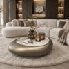 Castello salontafels rond en organisch met Sintered Stone tafelblad en mat bronzen onderstel in luxe woonkamer | Dubbelman Design