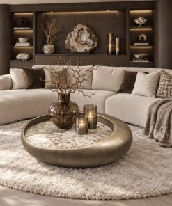 Castello salontafels rond en organisch met Sintered Stone tafelblad en mat bronzen onderstel in luxe woonkamer | Dubbelman Design